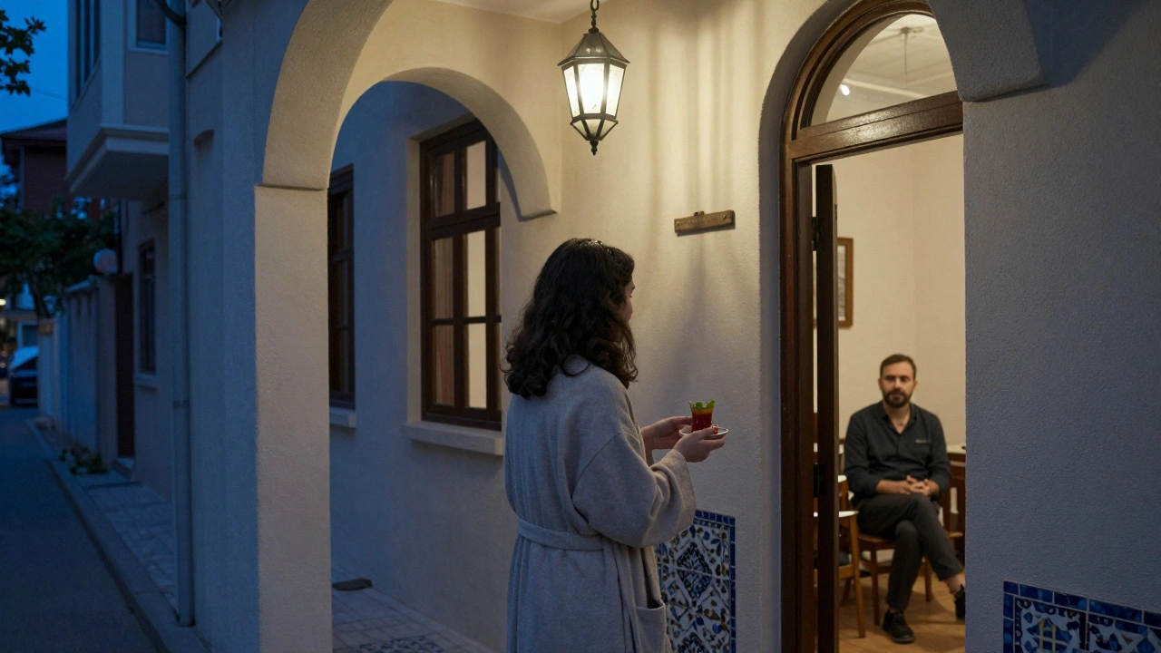 A traveler greeted at a quiet, unmarked door in Bebek, holding tea, as a therapist waits inside in dim twilight.